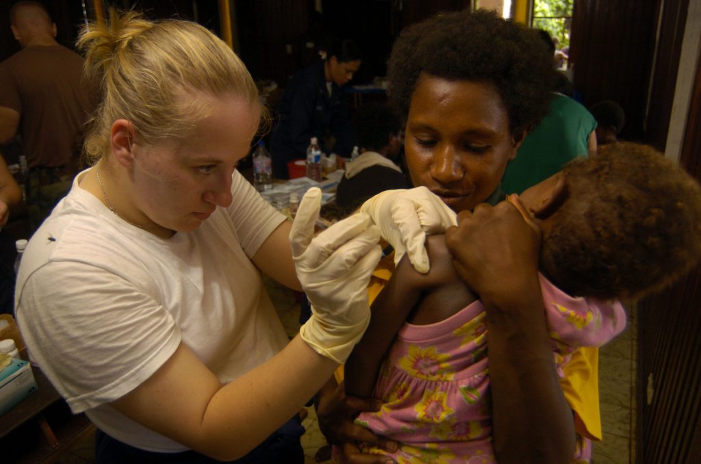 Shot of tetanus for a child along with mother