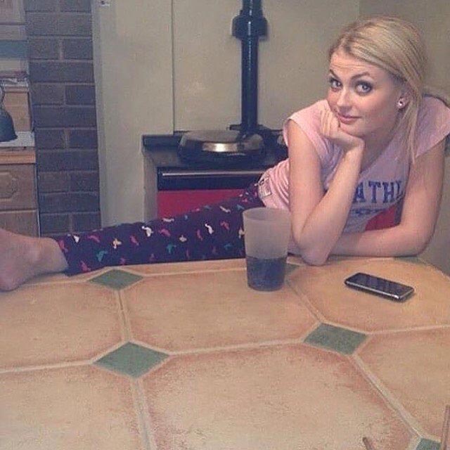 Lucy Fallon in casuals with a drink
